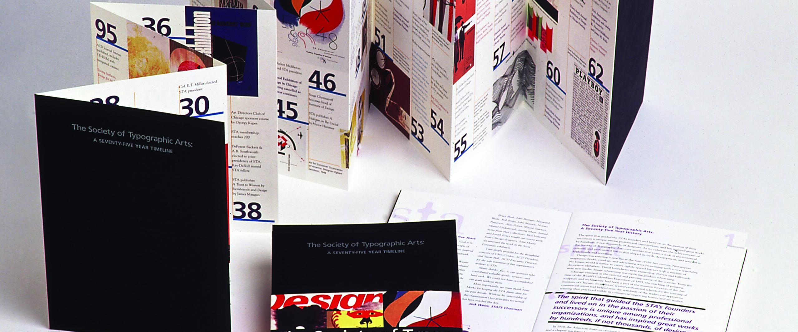 Folded brochures and booklets titled "The Society of Typographic Arts: A Seventy-Five Year Timeline" with colorful graphic designs and text.