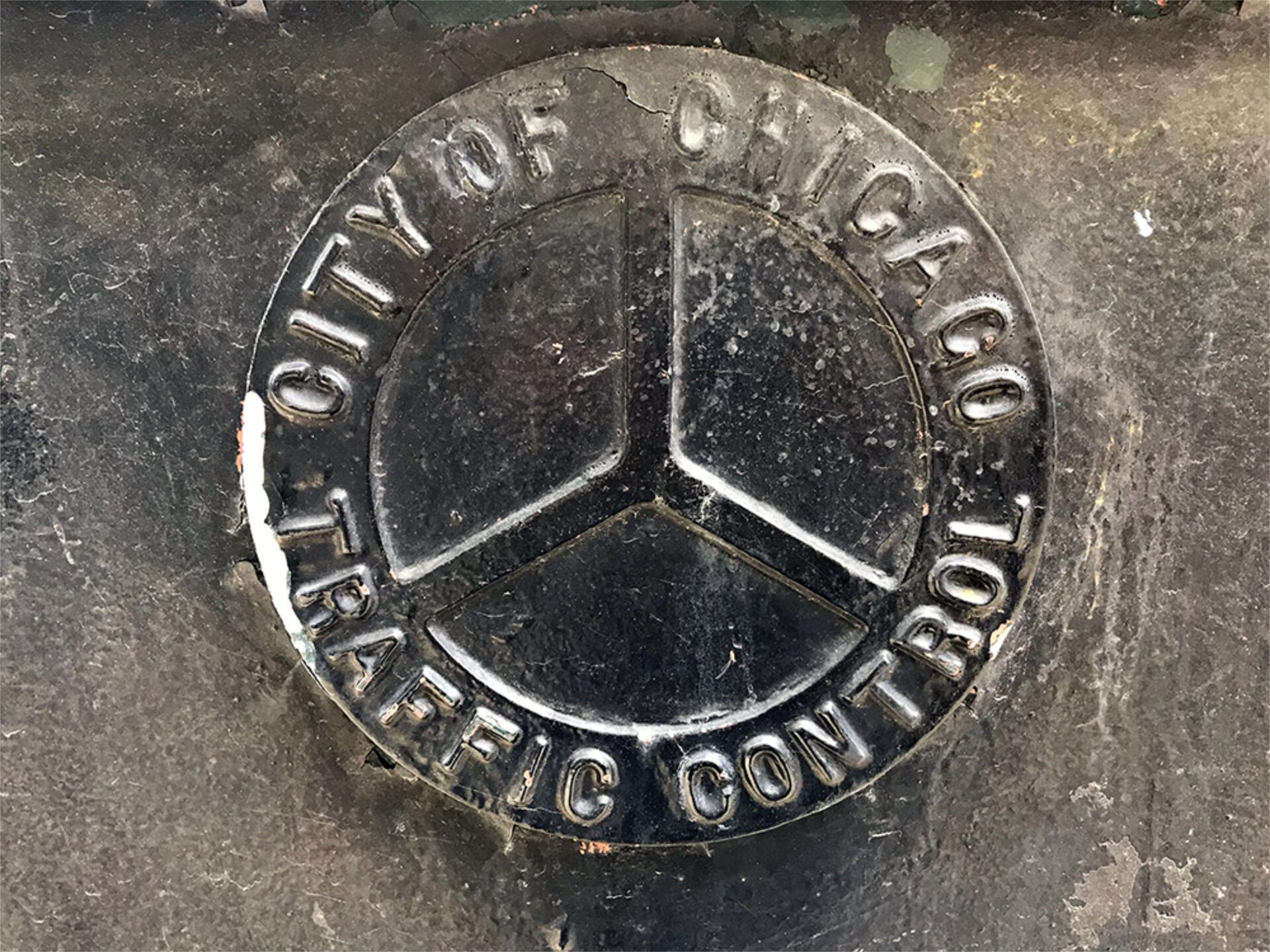 A Traffic Control box in downtown Chicago displaying the upside down Municipal Device.