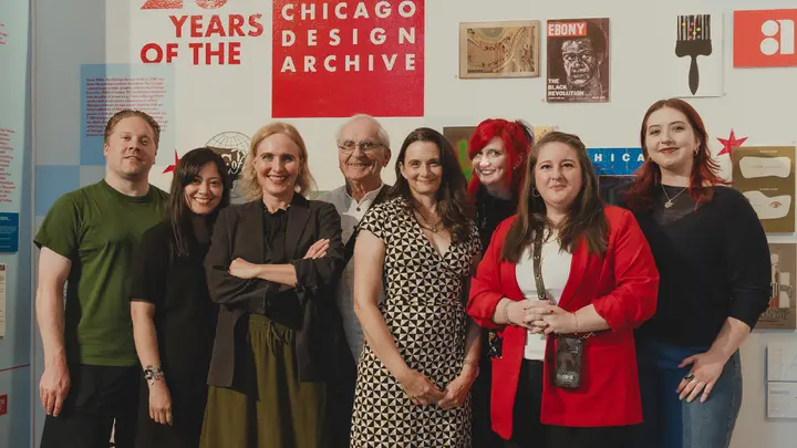 A group of people in front of a CDA banner.