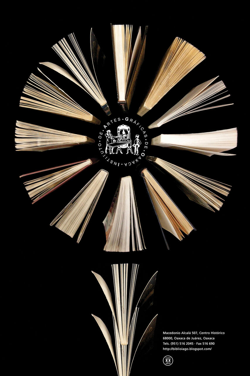 Open books arranged in a circular pattern on a black background with pages facing outward. In the center is a white logo of a person at a desk with text encircling it. Below, more open books create a vertical design.