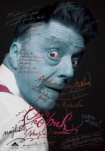 A man's face painted blue with an expressive, surprised look, surrounded by handwritten text in various colors on a dark background, part of a theatrical poster design.