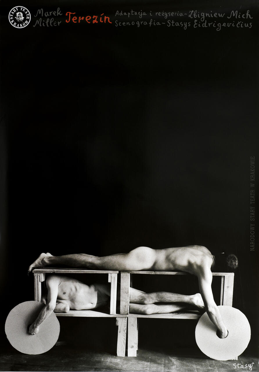 Two nude figures lie on a wooden table, each holding a large circular sheet in their hand. The image is in black and white, creating a stark contrast between the figures and the dark background.
