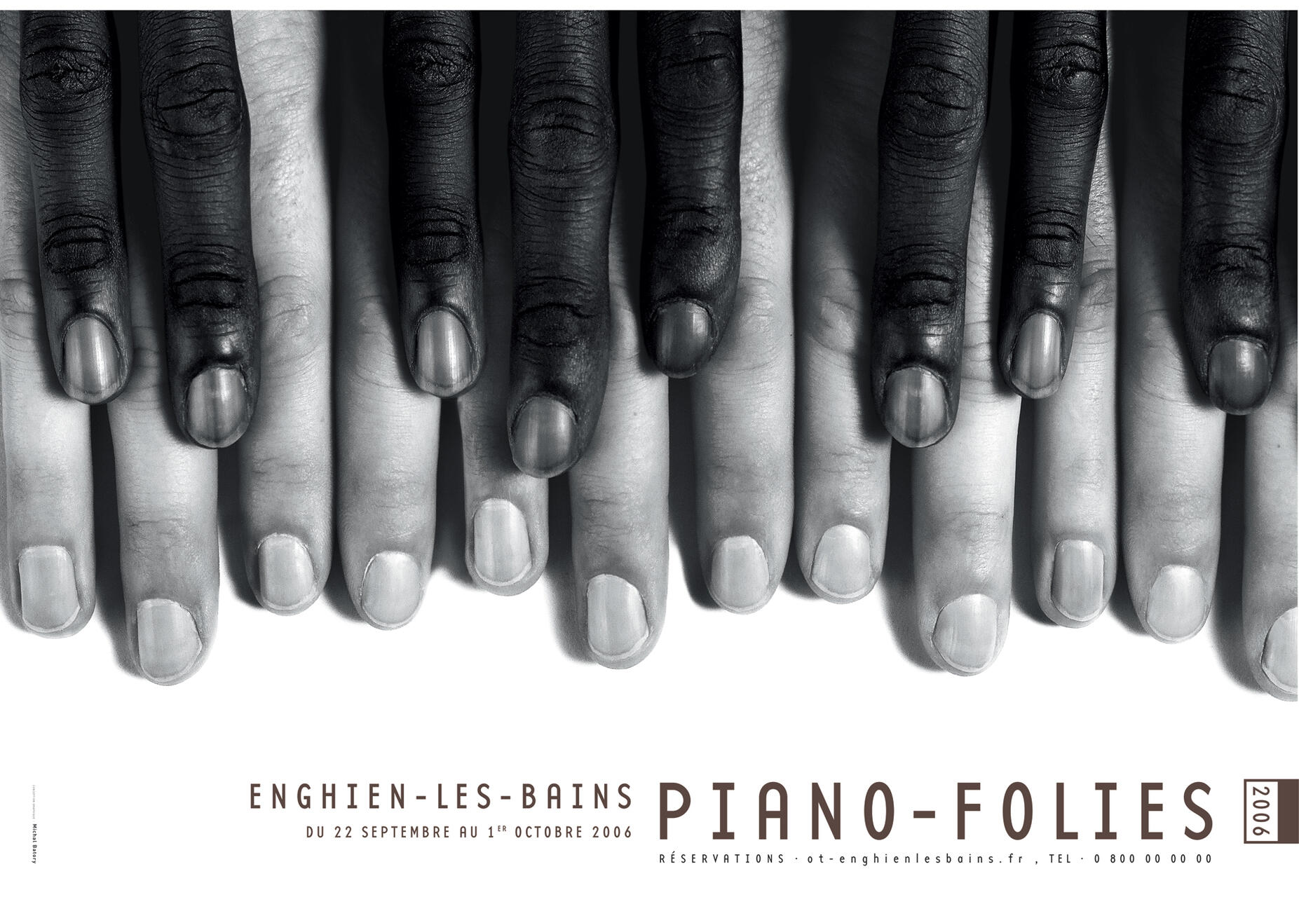 Black and white photograph of three pairs of interlaced hands with different skin tones arranged horizontally, resembling piano keys.