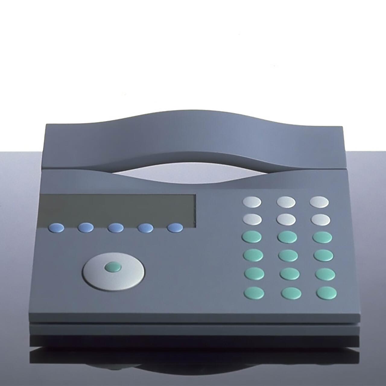 A sleek, modern telephone with a curved handle, featuring a digital screen and buttons in shades of blue and green, placed on a reflective dark surface.