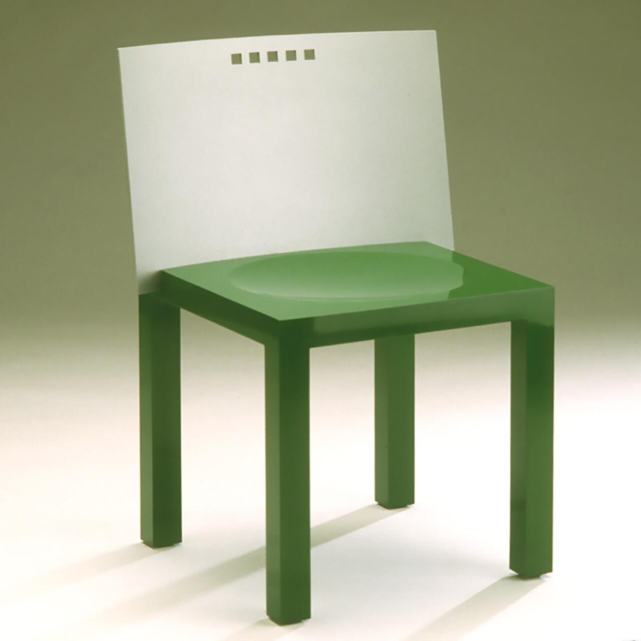 A modern green and white chair with a minimalist design, featuring a green seat and legs, and a white backrest with small square cutouts.