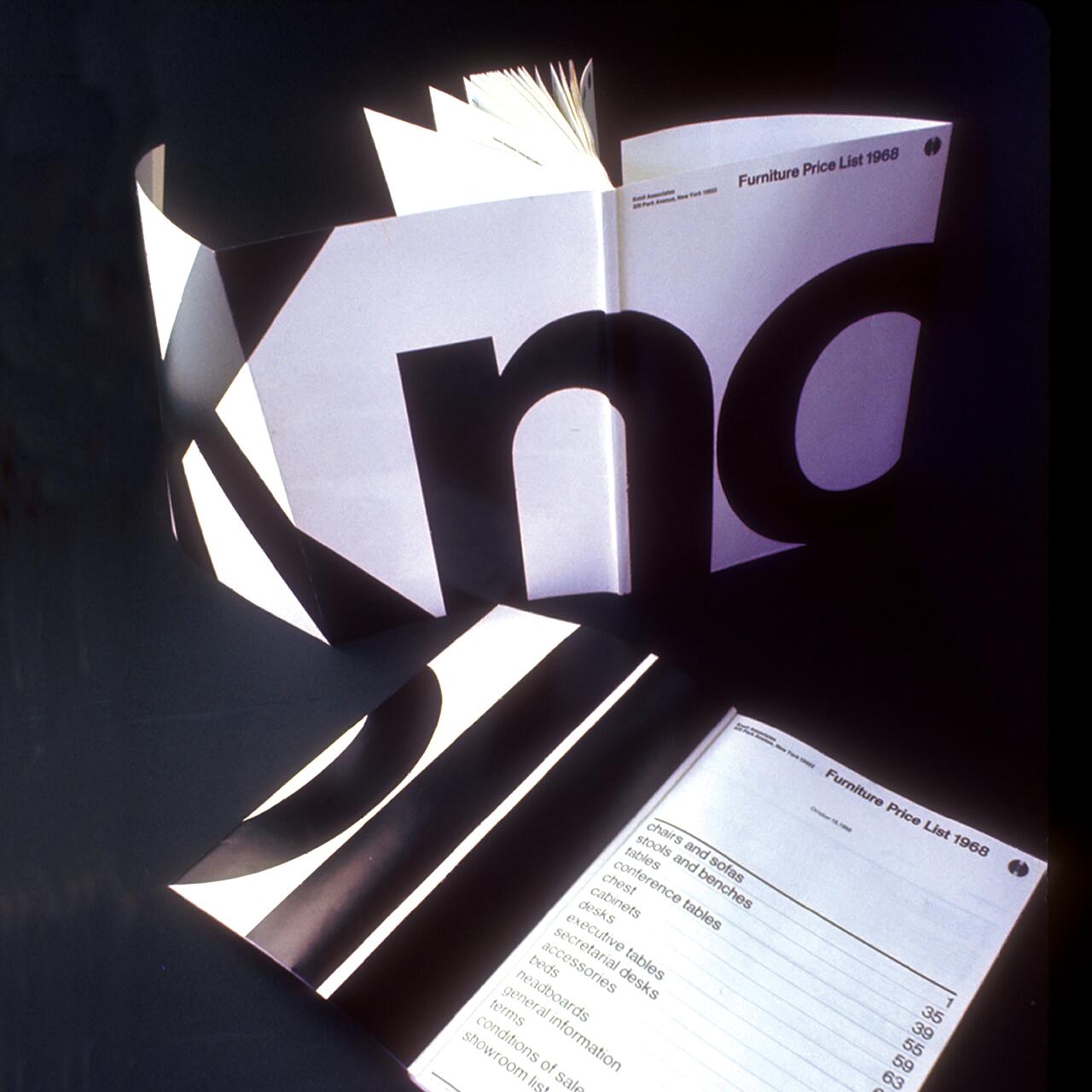 Open furniture price list catalog from 1988 with bold, large black letters on the cover and visible list of furniture items on an inside page.