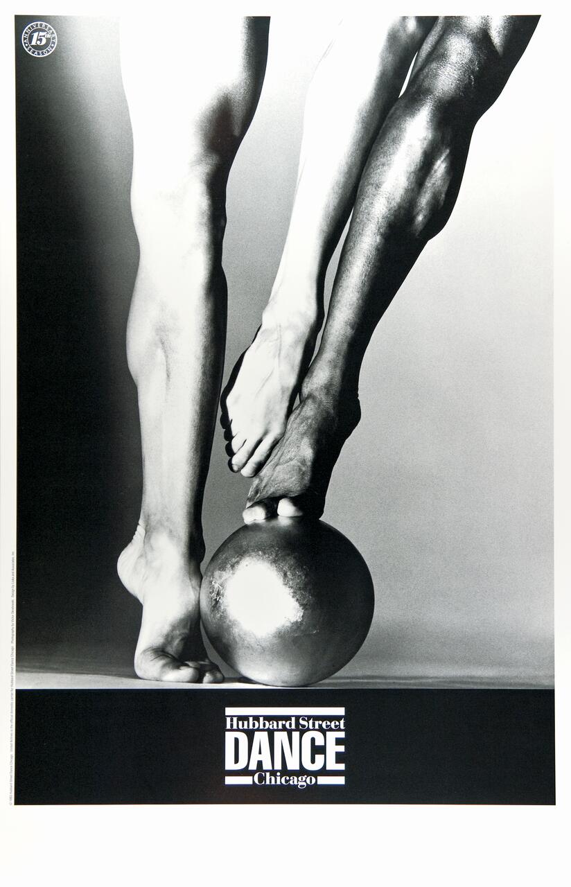 Two dancers' legs and feet in black and white performing a pose on a large sphere, showcasing strength and balance. Text at the bottom reads, "Hubbard Street Dance Chicago."