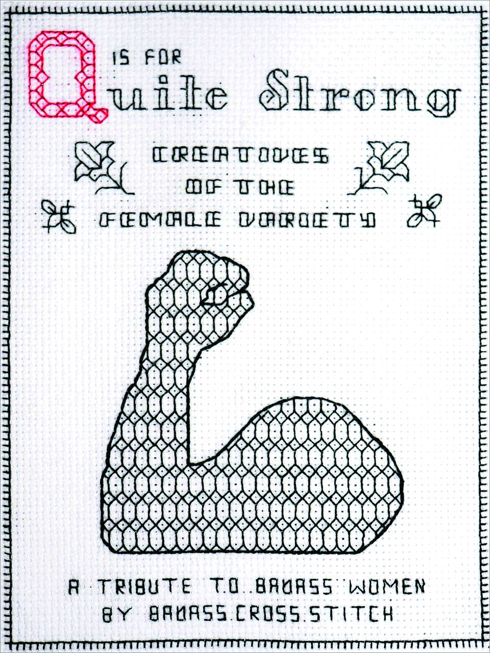 Cross-stitch design featuring the phrase "Q is for Quite Strong," with a pattern of a flexed arm and decorative elements. Appears to be a tribute to strong women.