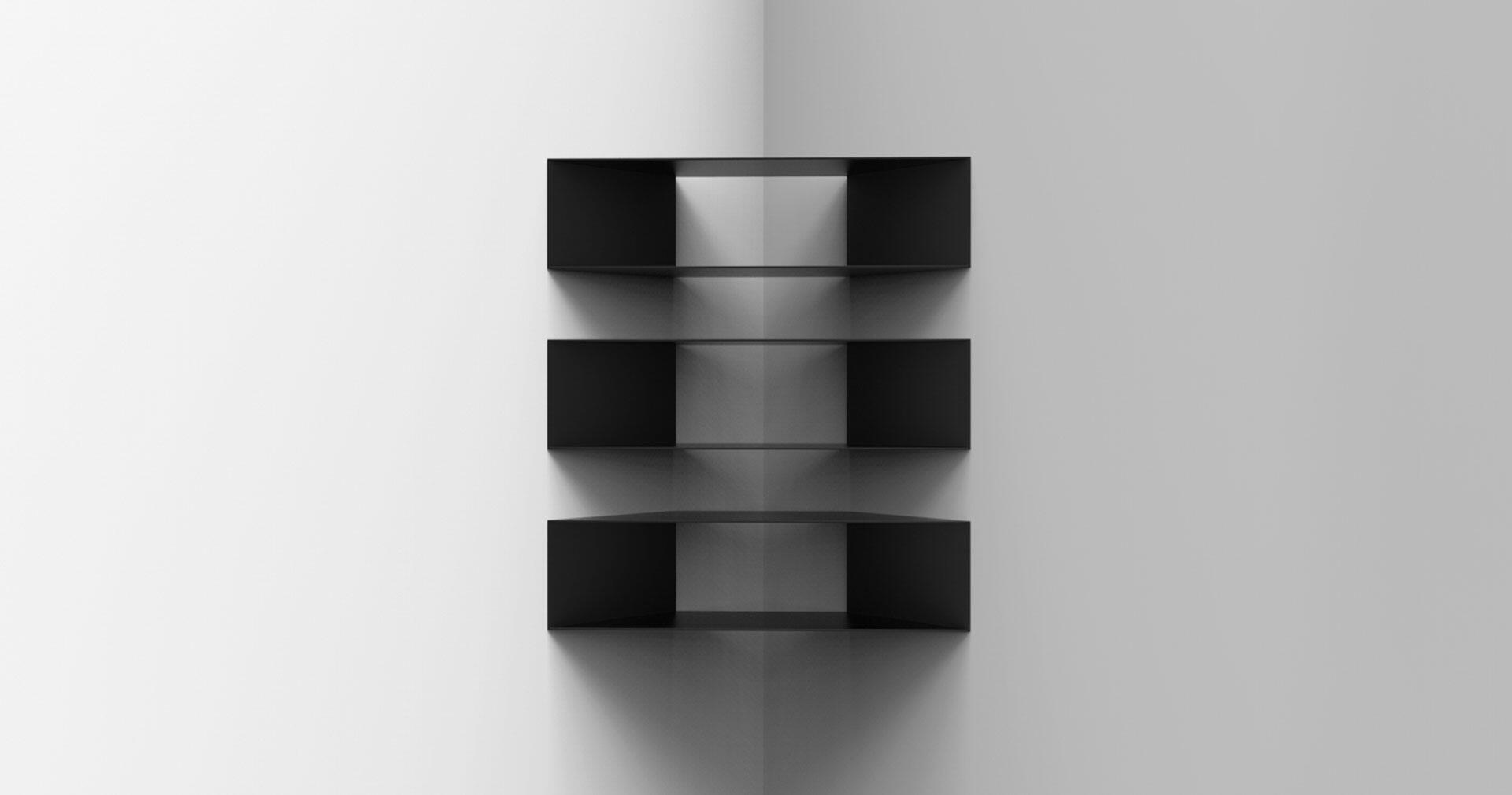 Black floating shelves arranged vertically on a corner wall with even spacing. Bright white and light gray walls create a minimalist look.