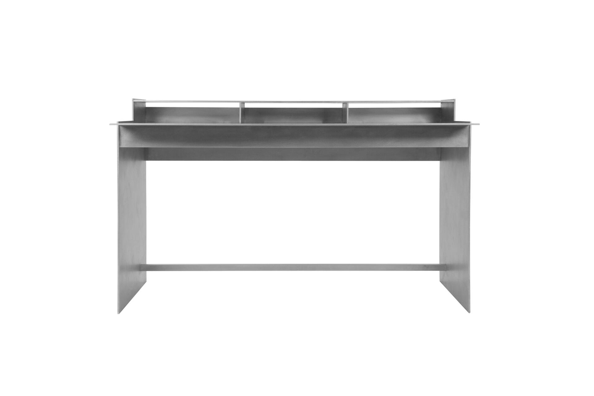 Minimalist gray metal desk with a flat top and two side panels, featuring open compartments in the upper section.