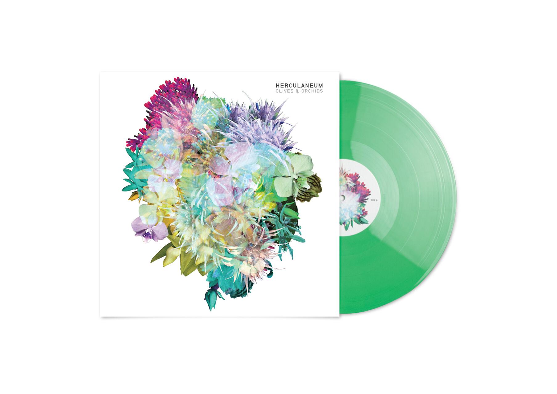 Colorful floral art on a white album cover with a translucent green vinyl record partially visible.