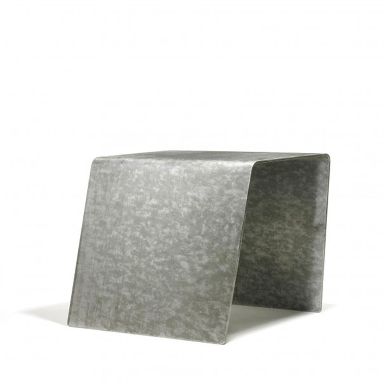 Metal stool with a minimalist design, featuring a curved rectangular shape with a seamless surface and matte gray finish.