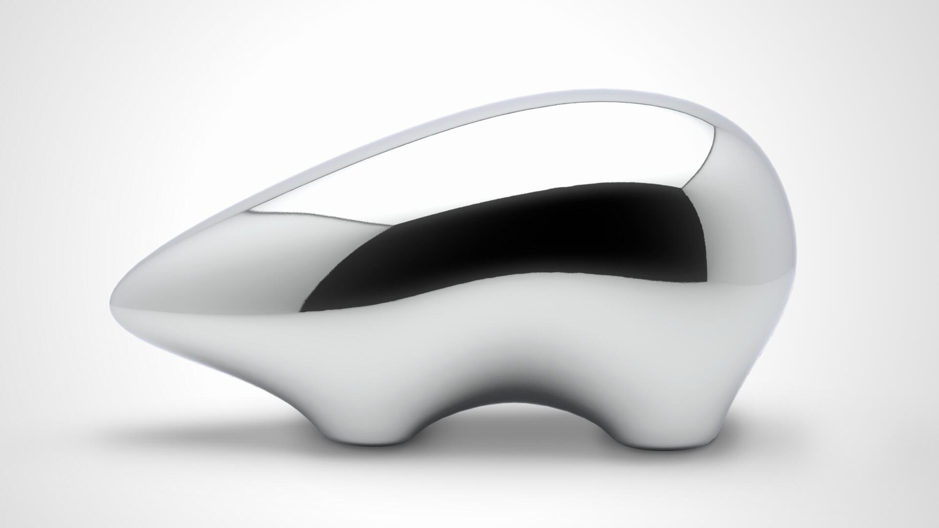 Shiny, abstract silver sculpture with smooth curves and a reflective surface, set against a plain white background.