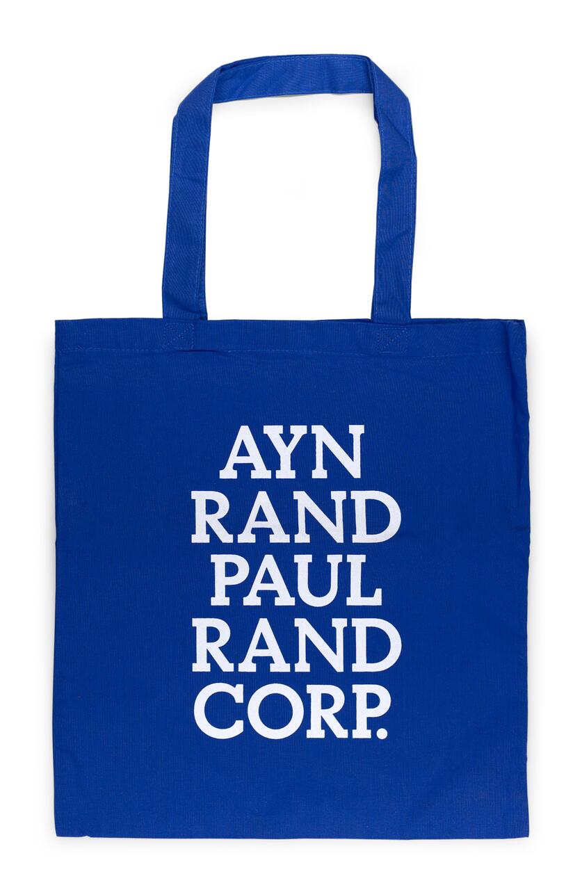 Blue tote bag with white text stacked vertically: "AYN RAND PAUL RAND CORP."