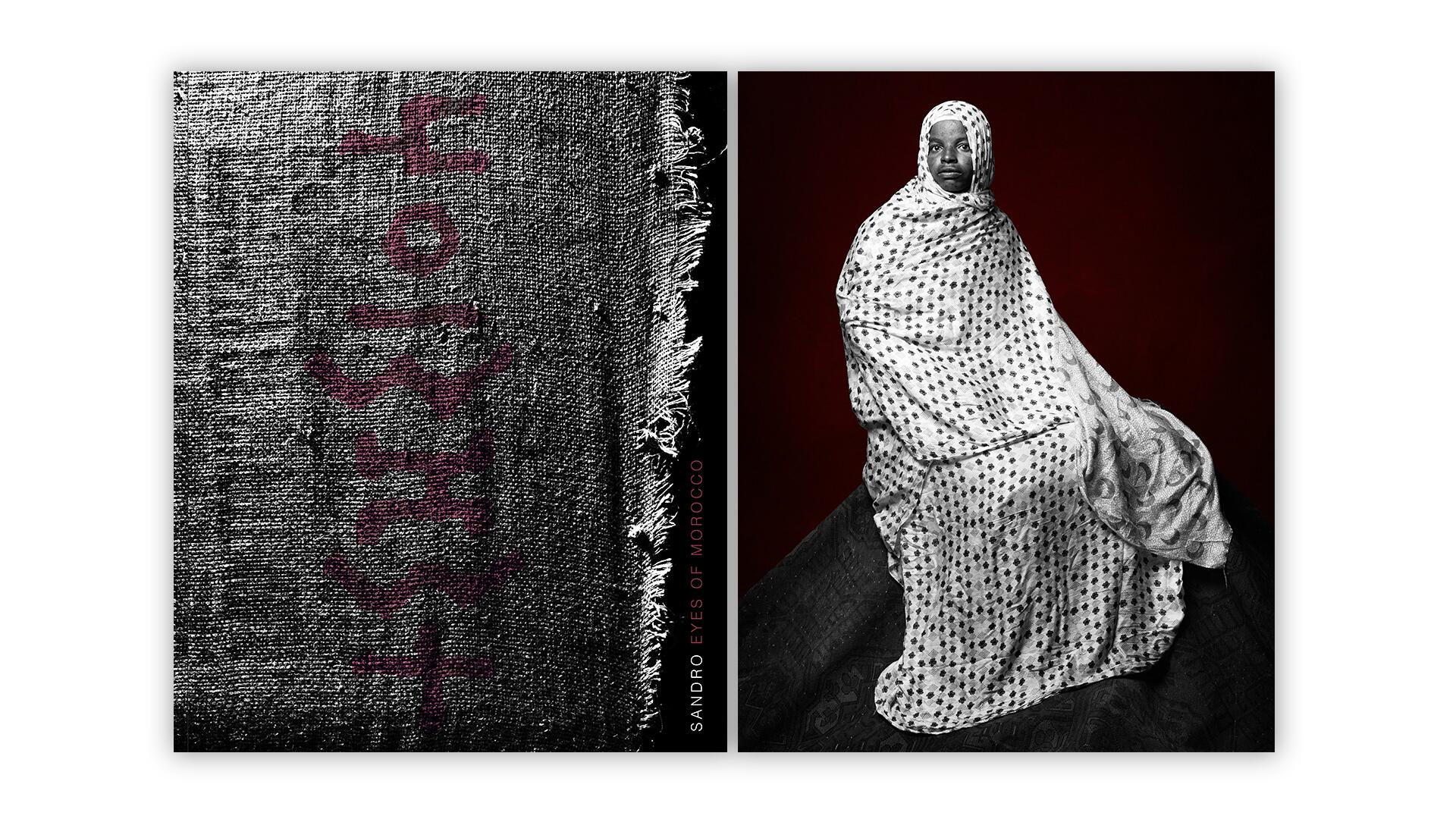 A woman draped in a white, patterned cloth sits against a dark red background, accompanied by textured fabric with red lettering on the left side.