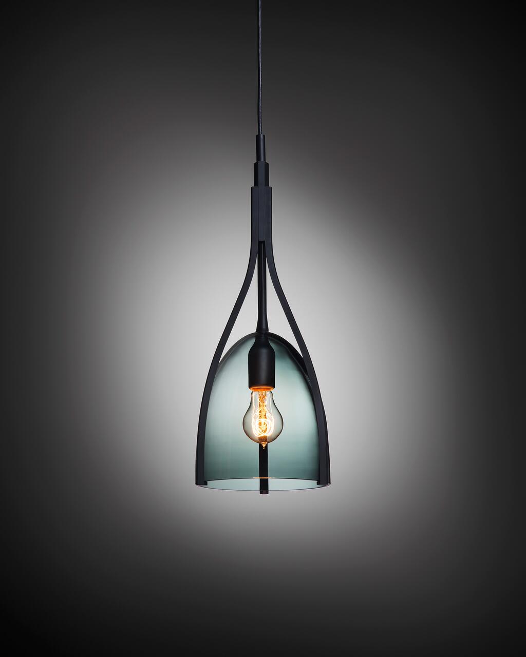 Hanging pendant light with a modern black metal frame and exposed bulb, set against a dark gray gradient background.
