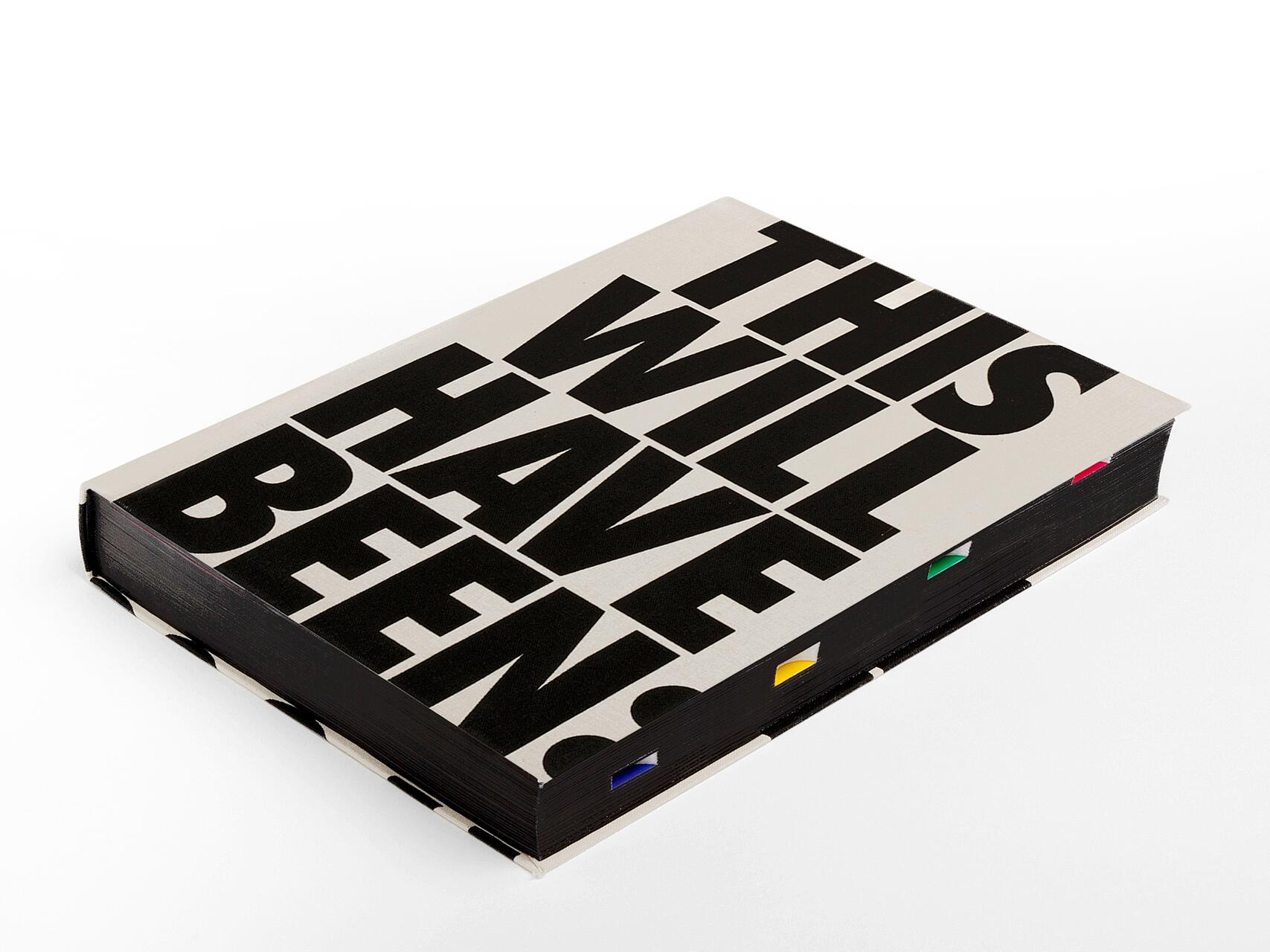 Closed book with a beige cover featuring large black text that reads "THIS WILL HAVE BEEN." The book has colored tabs peeking from the pages, against a white background.