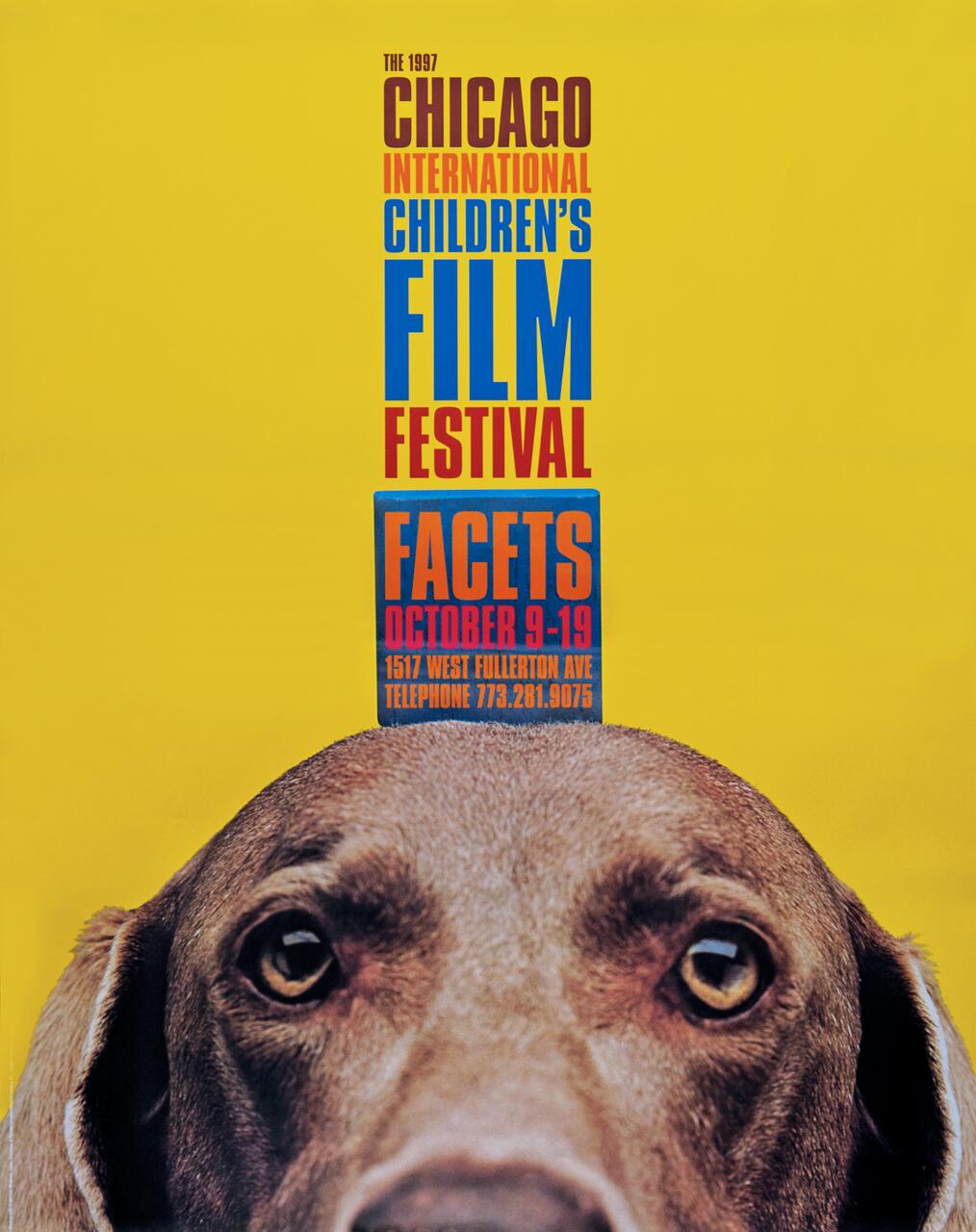 Film festival poster with a yellow background and colorful text about the 1997 Chicago International Children's Film Festival. The top of a dog's head with attentive eyes is visible at the bottom.