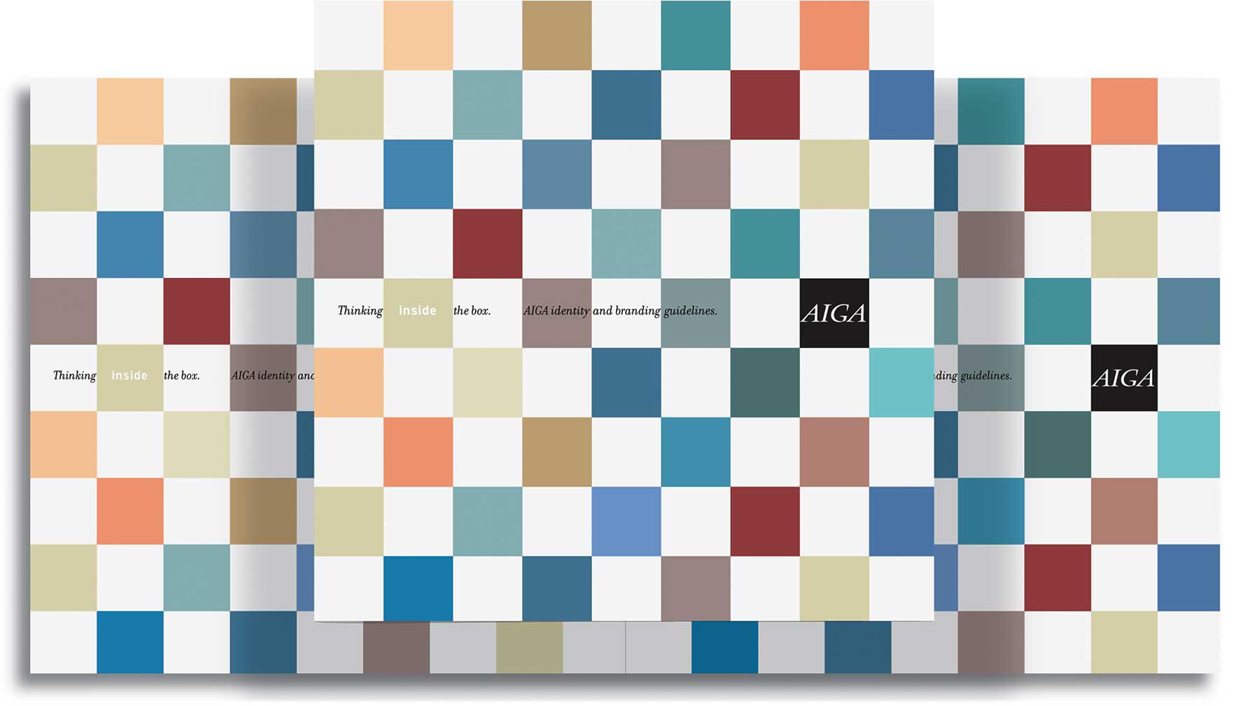 Colorful checkerboard pattern with squares in blue, red, beige, and gray tones. Two overlapping pages with the text "Thinking inside the box." and "AIGA" on black squares. Graphic design style with a minimalist aesthetic.