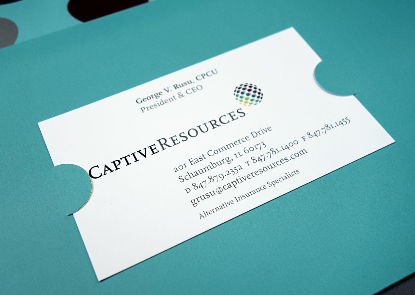 Business card on a teal background with contact information for Captive Resources, featuring a multicolored dotted logo.
