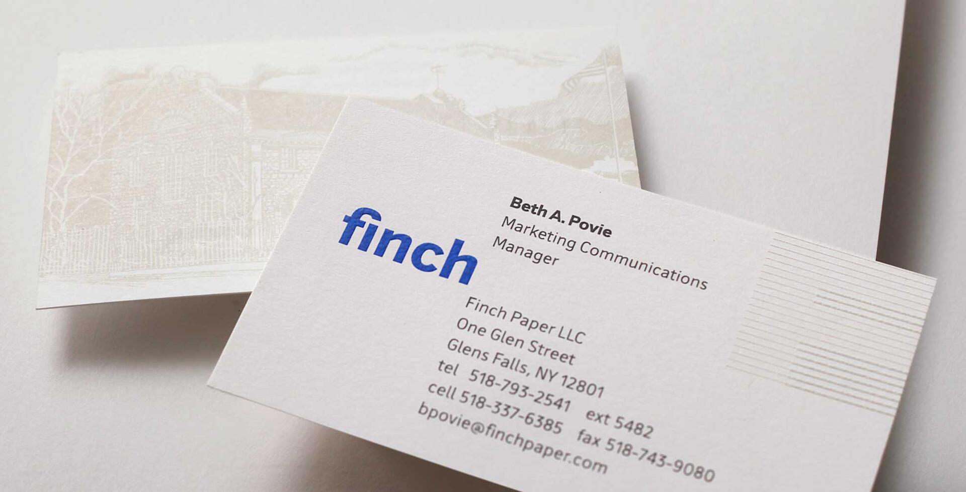 Business card for Beth A. Povie, Marketing Communications Manager at Finch Paper LLC, featuring a blue "finch" logo and contact details.