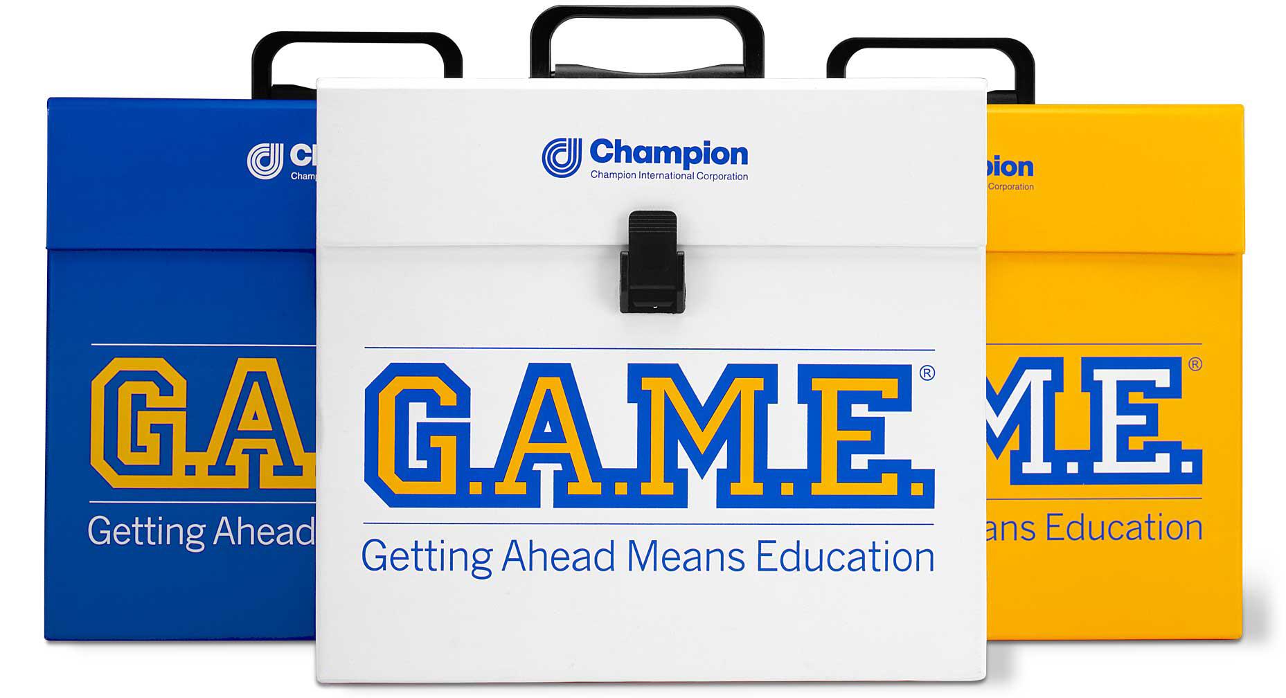 Three colorful Champion briefcases with handles, displaying the acronym G.A.M.E. in bold, outlined letters. Each briefcase has text "Getting Ahead Means Education." The red, blue, and yellow colors create a vibrant appearance.