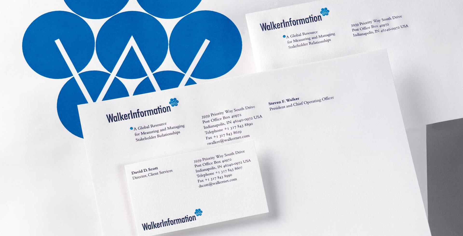 Business stationery set with WalkerInformation letterhead, business card, and envelope, featuring a blue geometric logo and text.