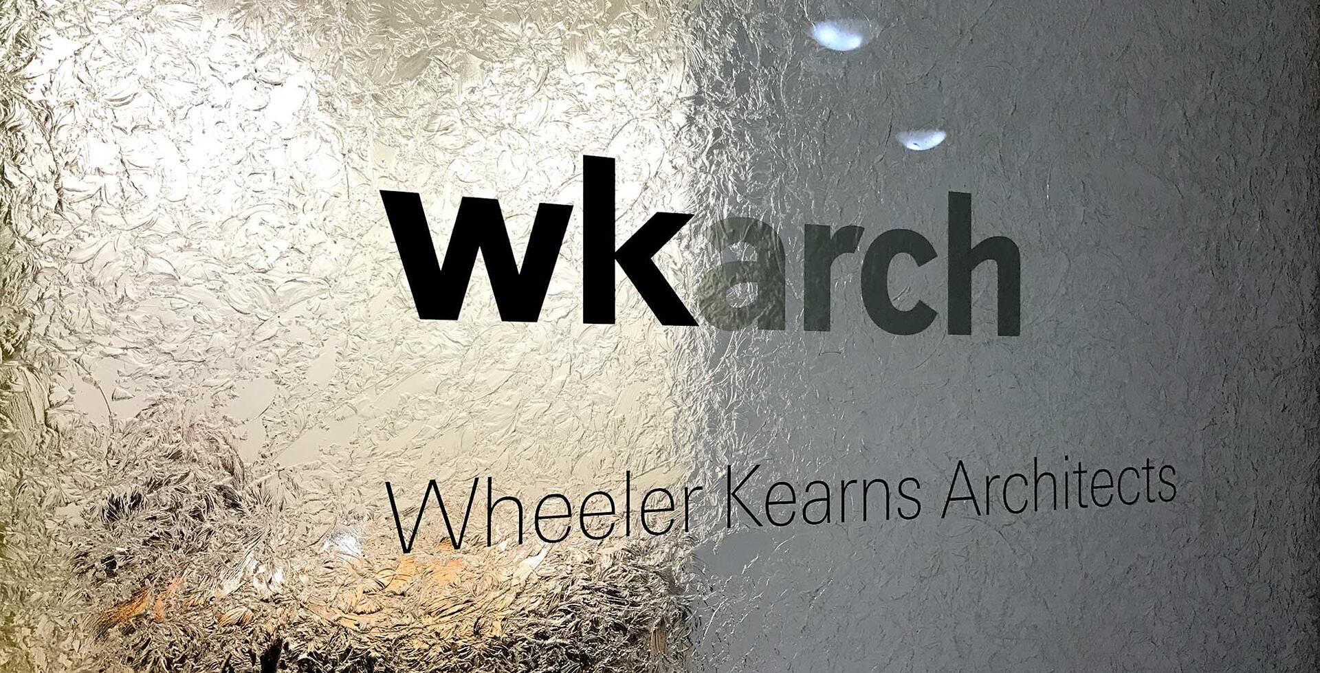 Text on frosted glass reads "wkarch" and "Wheeler Kearns Architects."