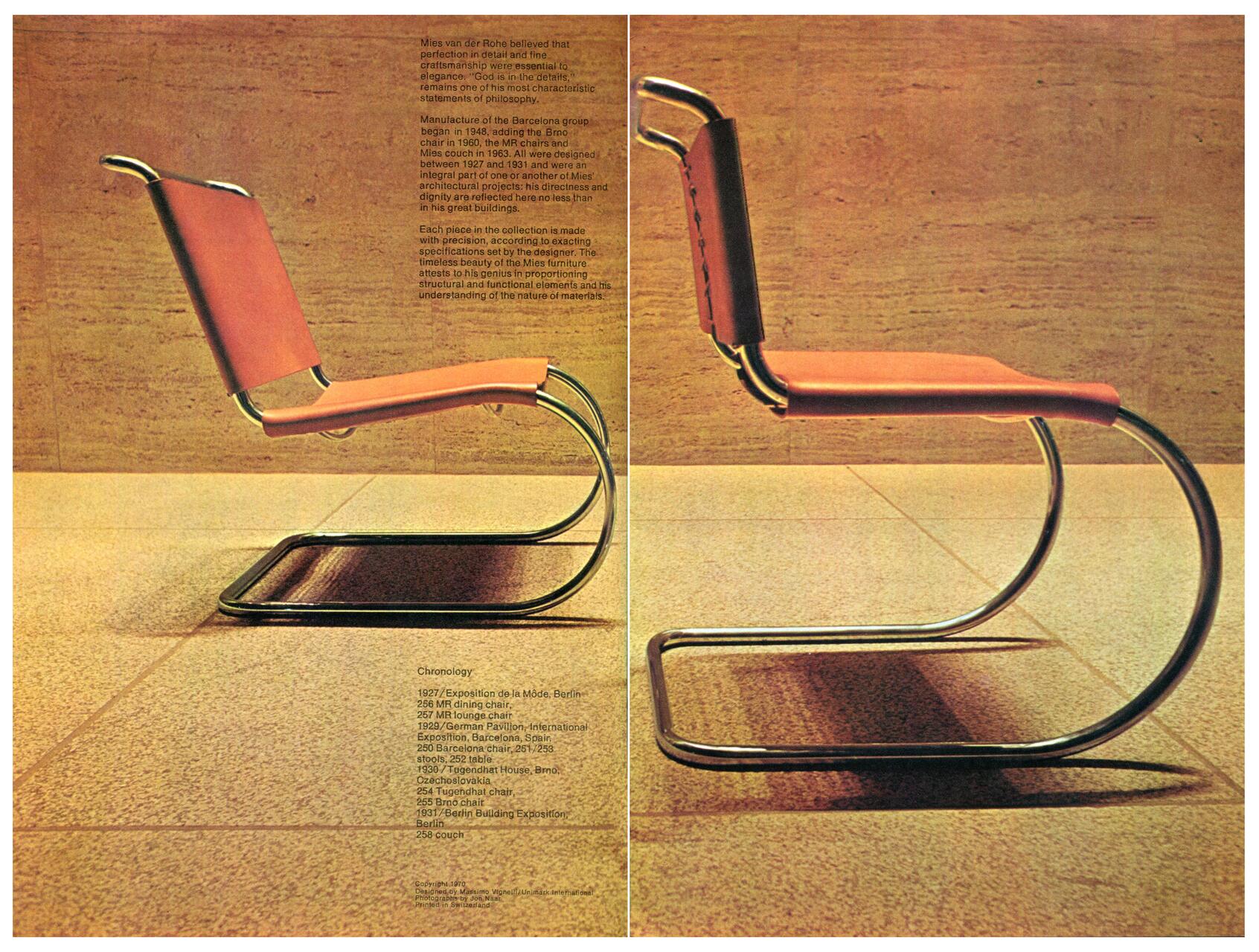 A pair of chrome-plated cantilever chairs with red leather seats and backs, positioned against a tan tiled wall. The chairs have a minimalistic, modern design with tubular steel frames.
