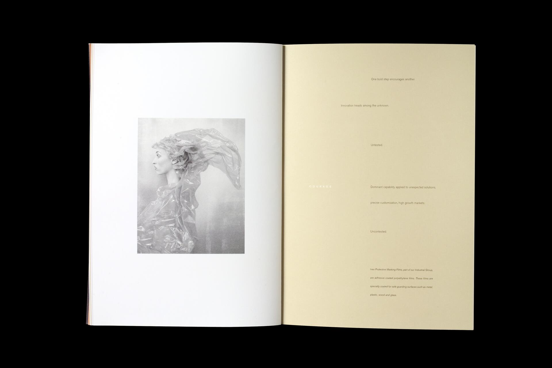 Open book with a black and white photograph of a person on the left page, draped in translucent material, and text on the right beige page.