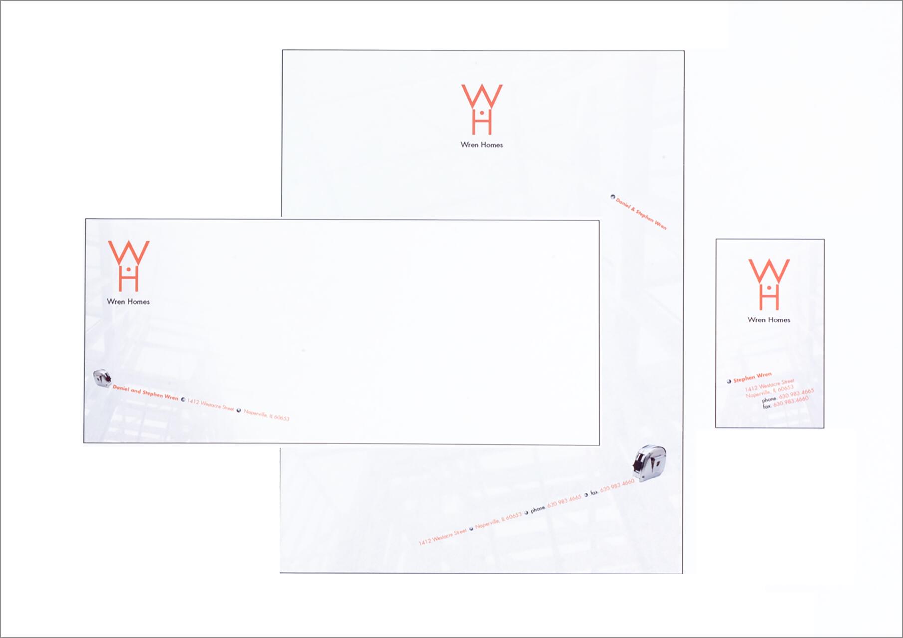 Stationery set for Wren Homes, including a letterhead, envelope, and business card. Each item features an orange logo with the initials "WH" and company details in a modern font.