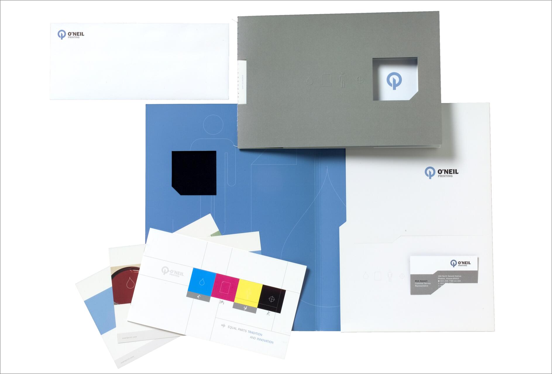 A collection of O'Neil Printing branded materials, including envelopes, a folder, business cards, and color swatches arranged on a white background.