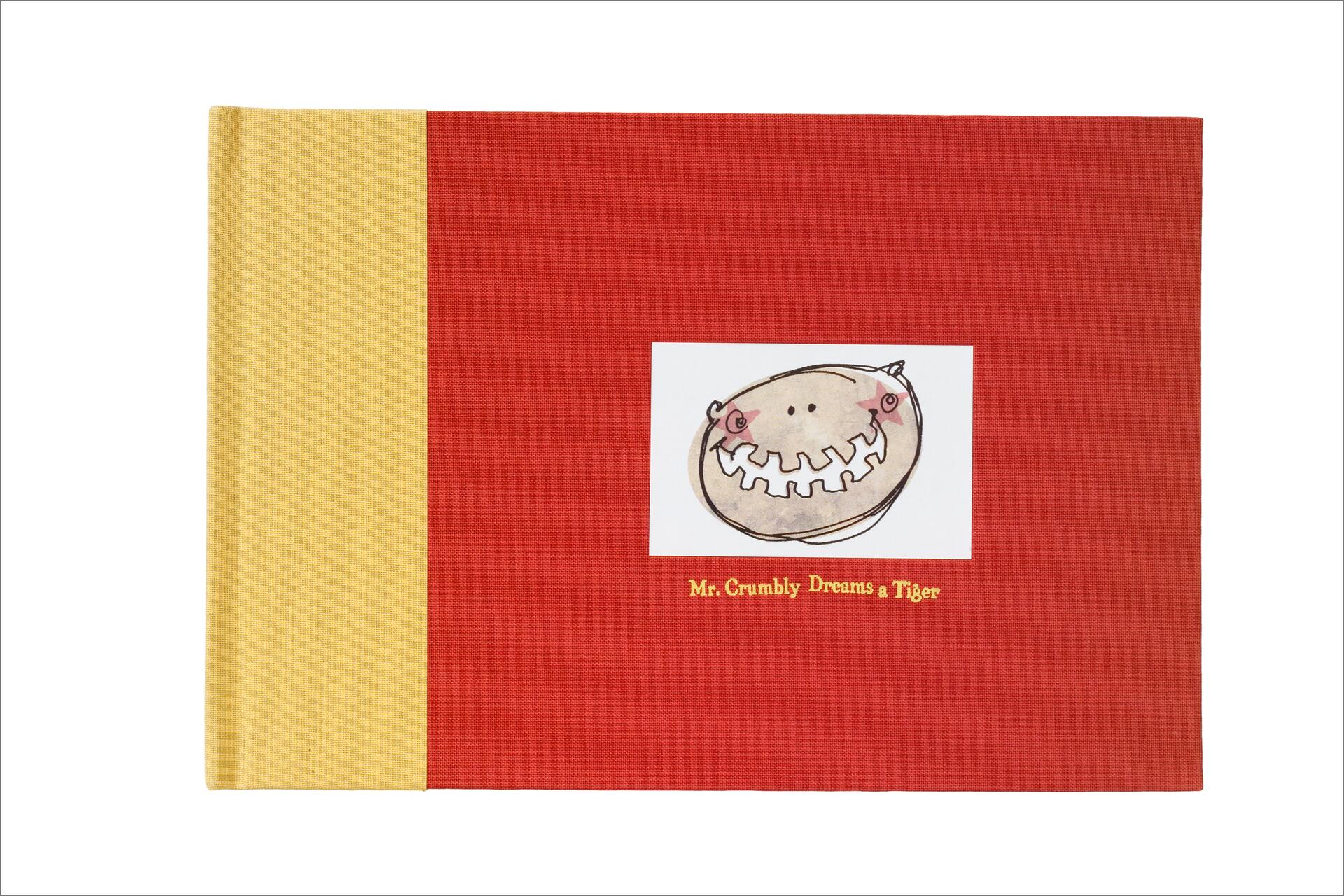 Red and yellow hardcover book with an illustration of a smiling character on the front.