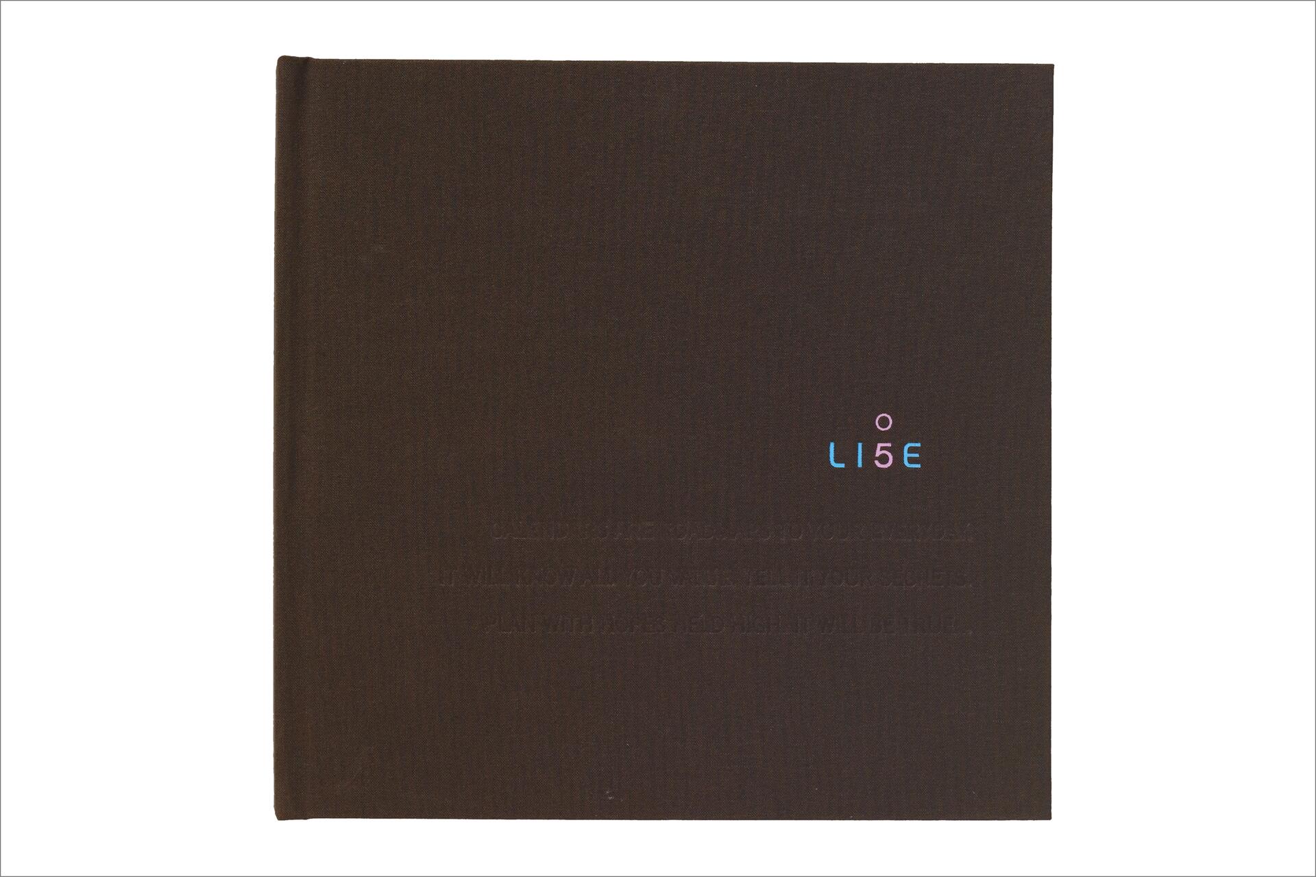Dark brown hardcover with the word "LI5E" in colored text near the top right.