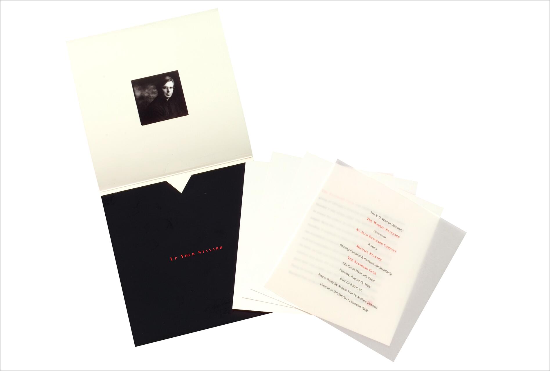 Open portfolio with a black cover and red text reading "UP YOUR STANDARD," containing a stack of translucent sheets with printed text. A small black and white portrait of a person is visible on the inner side of the cover.