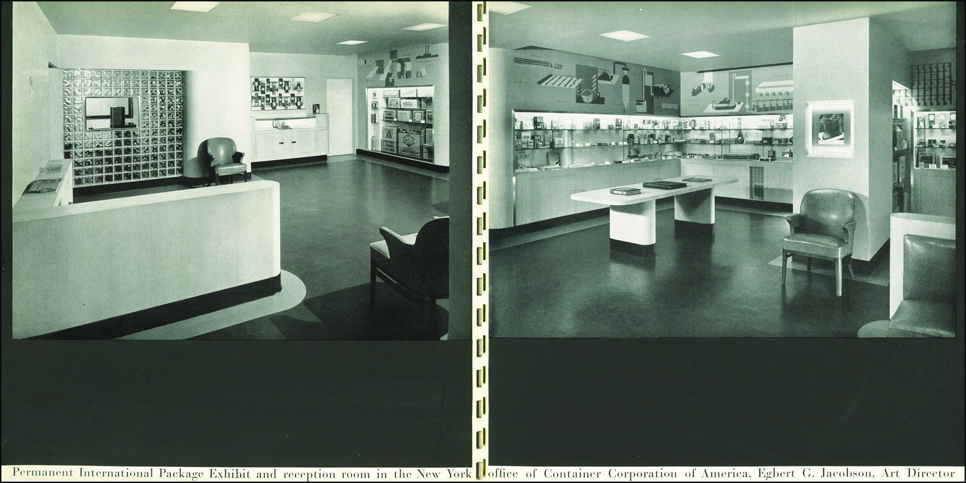 Exhibit and reception room in a mid-century modern style, featuring a sleek white counter, glass brick wall, chairs, and shelves displaying packaging designs. The space is well-lit with a clean, minimalist aesthetic.
