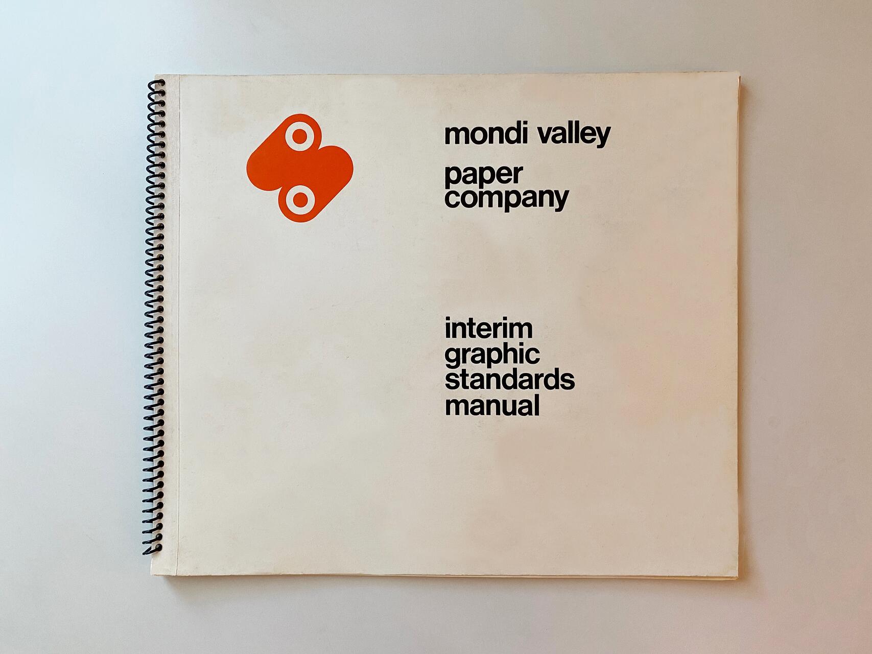 Spiral-bound graphic standards manual with "mondi valley paper company" text and an orange abstract logo on a beige background.
