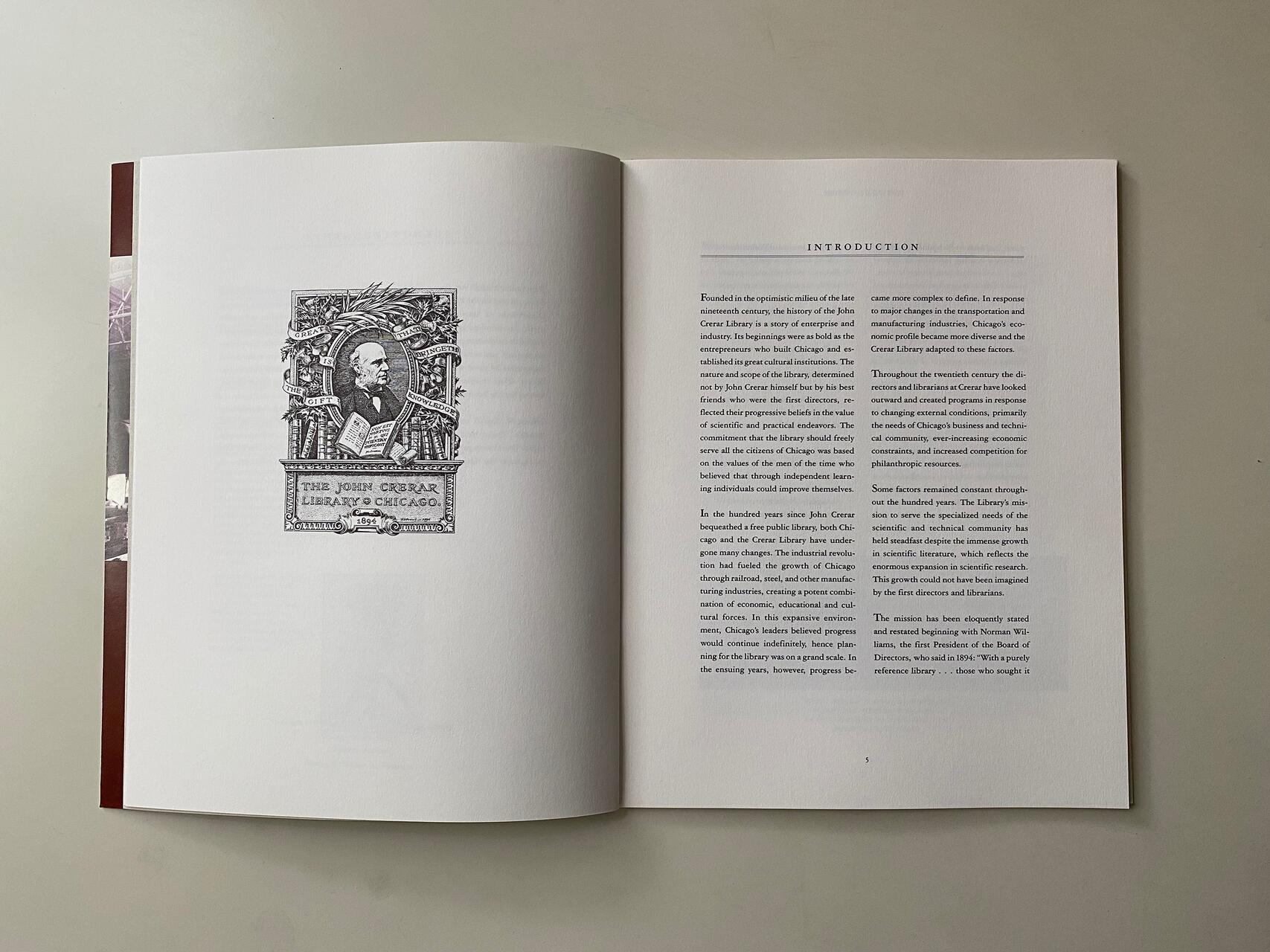 Open book showing a detailed illustration titled "The John Crerar Library of Chicago" on the left page and an "Introduction" text on the right. The book is laid open on a light surface.