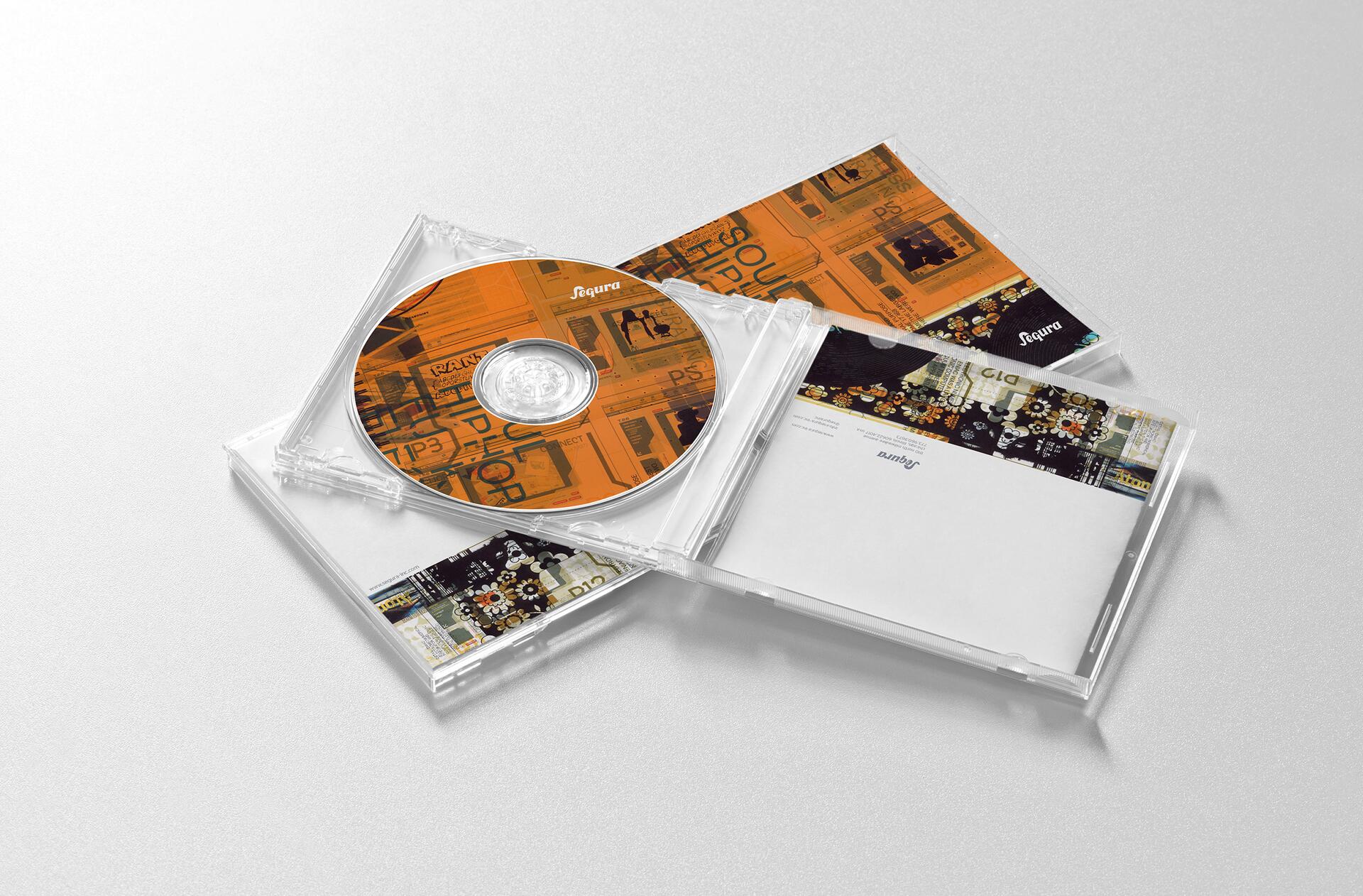 CD case with an orange disc inside, featuring abstract graphics and the word "Sequra." The cover and back show similar designs with black and gold accents. Set against a light gray background.