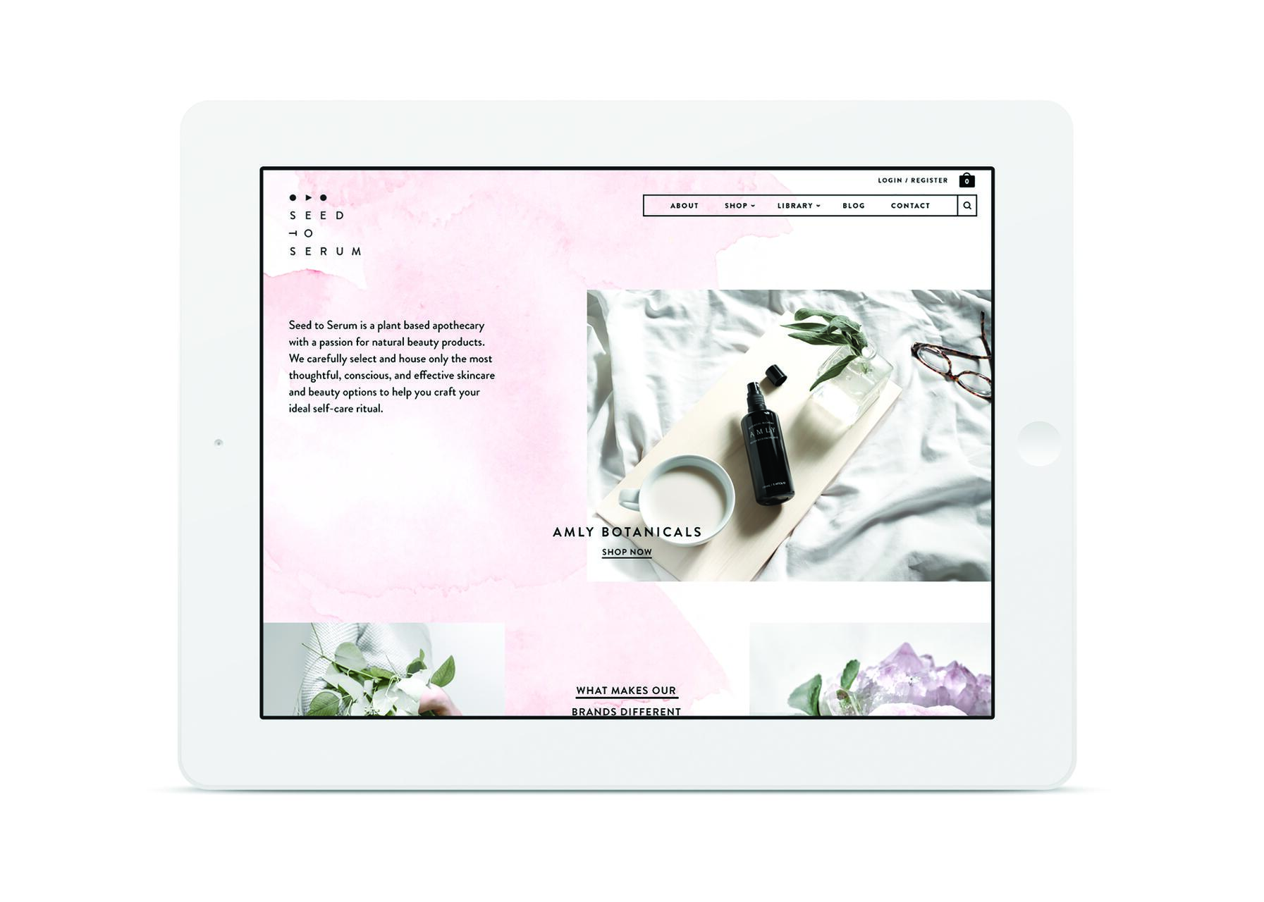 Tablet displaying Seed to Serum website with a pink watercolor background. Features a description of natural beauty products and an image of a black bottle labeled "AMLY" on a wooden board with leaves and a small bowl.