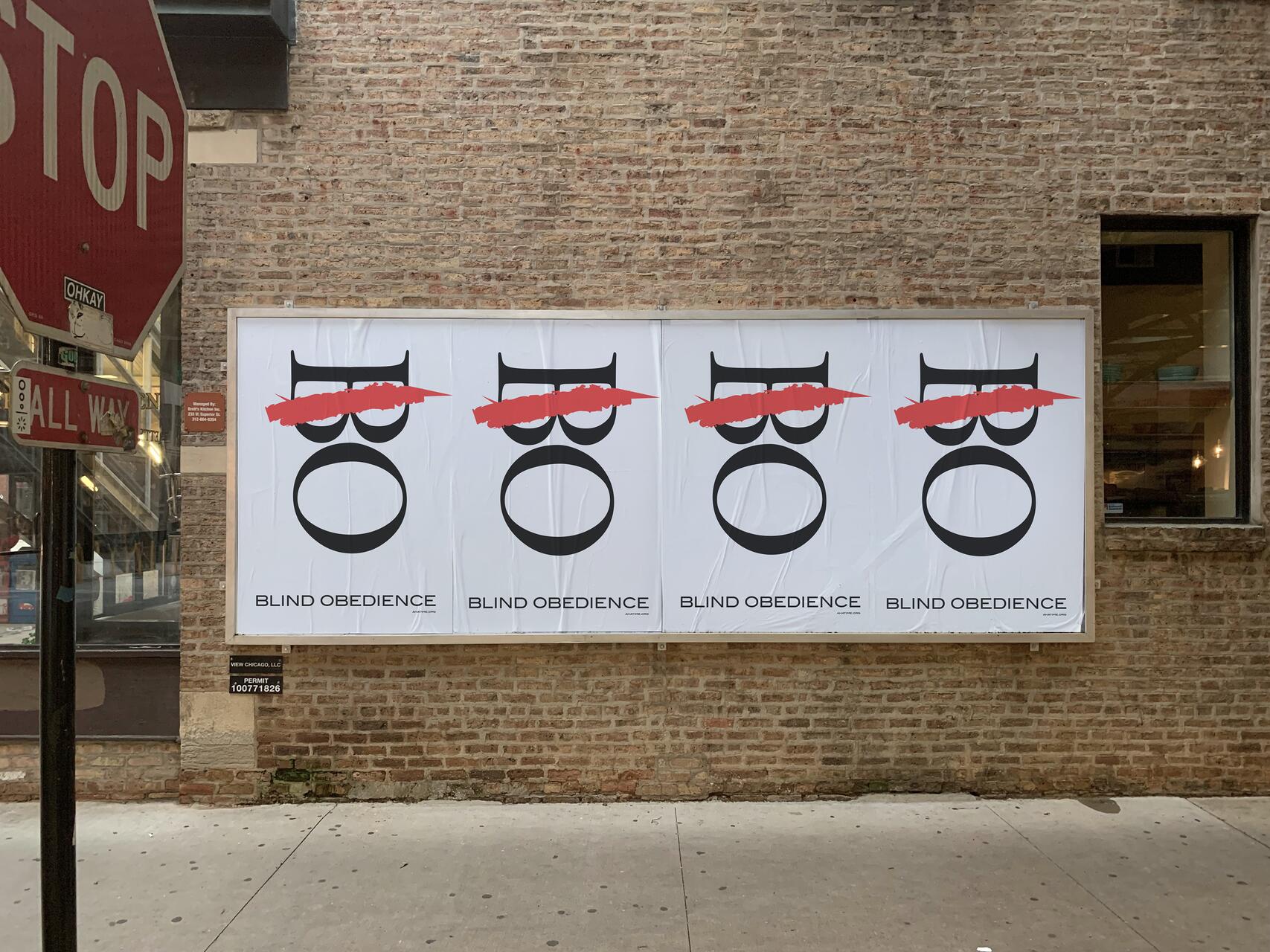 Four identical posters on a brick wall with abstract face designs. Each face has a red line crossing out the eyes and reads "Blind Obedience" below. A stop sign is partially visible to the left.