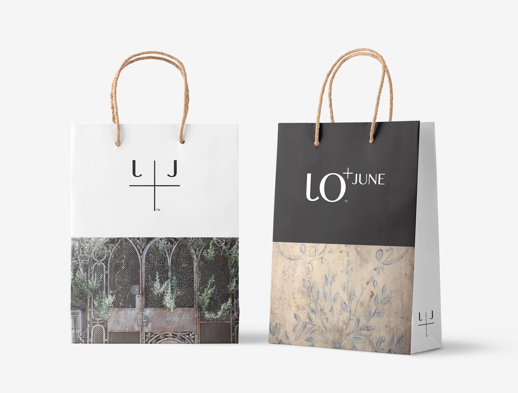 Two stylish shopping bags with rope handles, each featuring different artistic designs and logos. One is predominantly white with a green plant motif, the other black with a floral pattern.