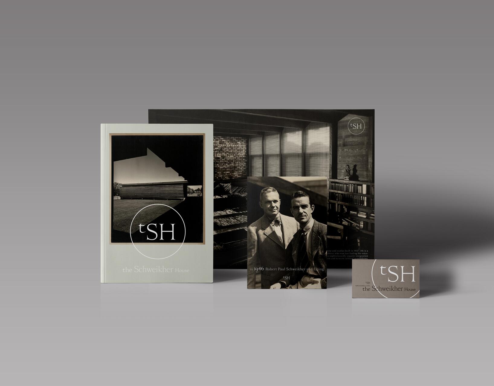 Three branded items featuring "tSH," the Schweikher House logo. Includes a brochure with a modern house image, a historical photo of two men in suits, and a business card. Set against a gradient gray background.