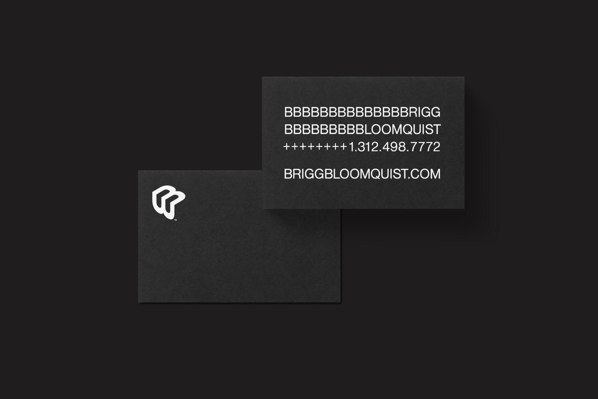 Two black business cards against a dark background. The card on the left displays a stylized white logo, while the card on the right shows text with a name, phone number, and website in white.