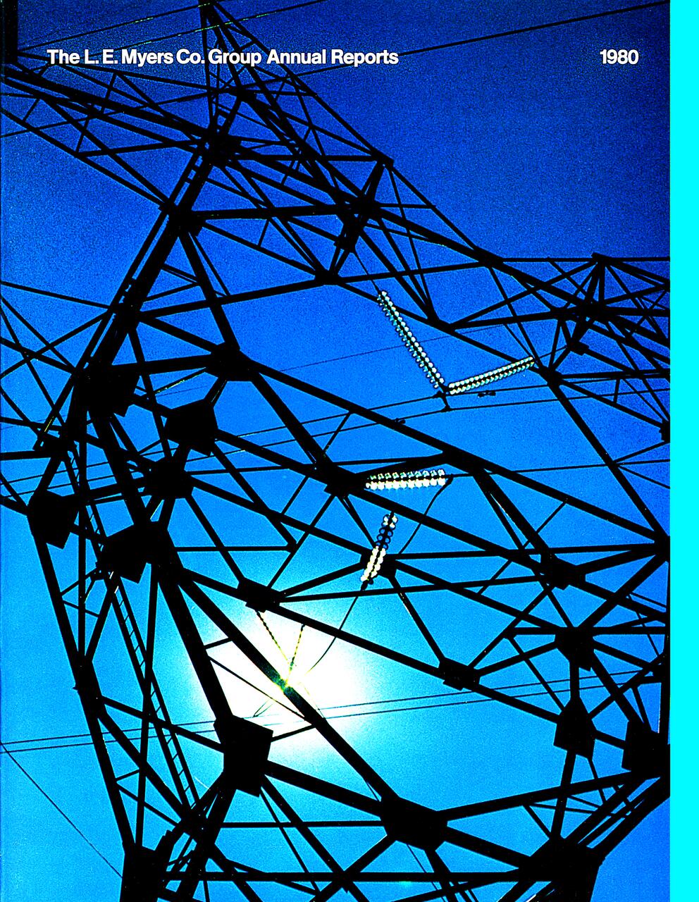 Electricity pylon silhouetted against a bright blue sky, with the sun shining through the lattice structure.