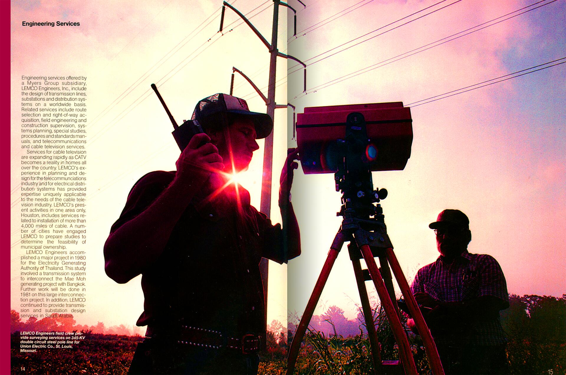 Silhouetted surveyors work with a tripod-mounted instrument under power lines at sunrise, with a glowing sunburst effect in the background.