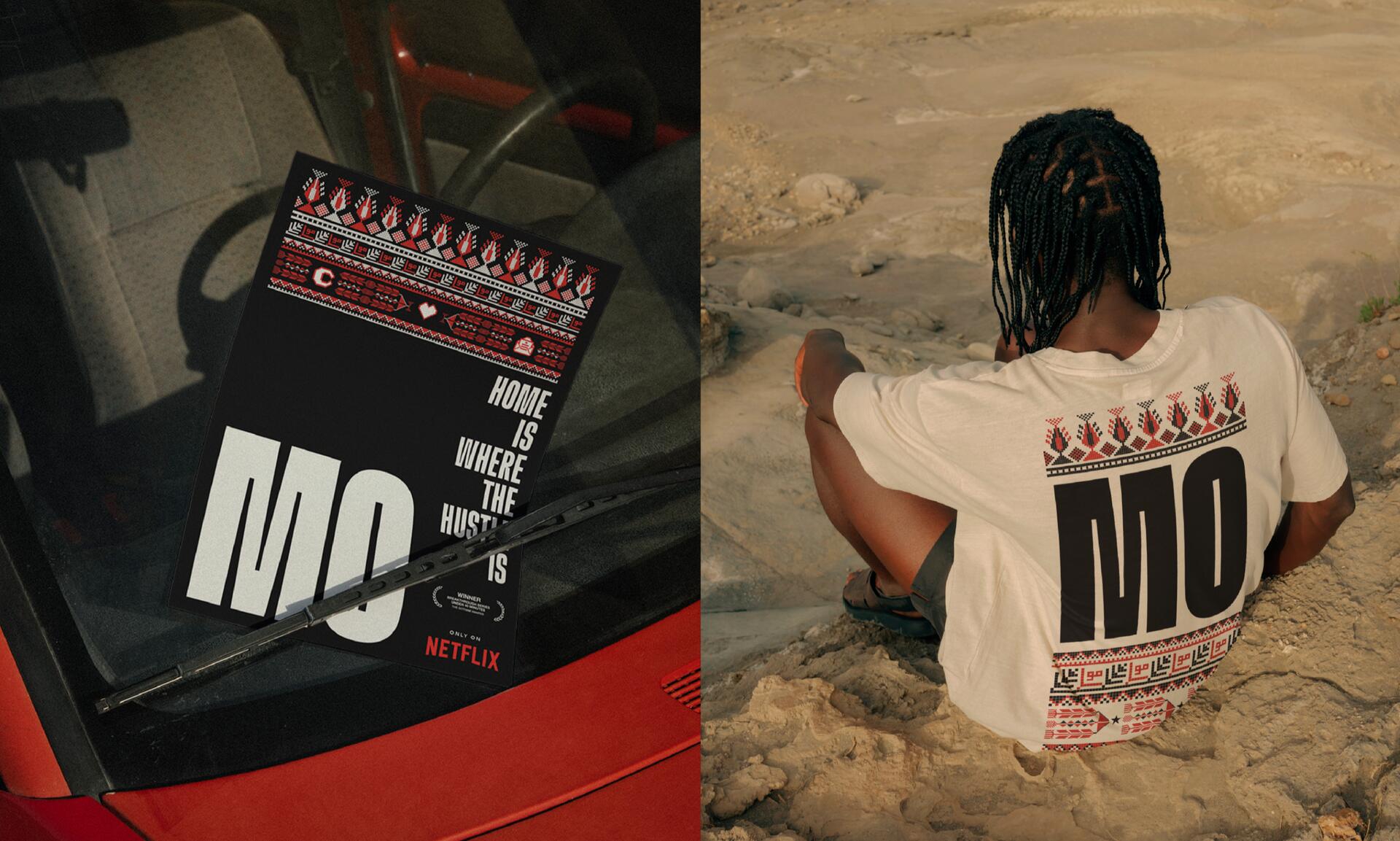 A person with braided hair, sitting on a rocky surface, wearing a white T-shirt with large black letters "MO" and red geometric patterns. On the left, a close-up of a red car's windshield with a poster in similar style.