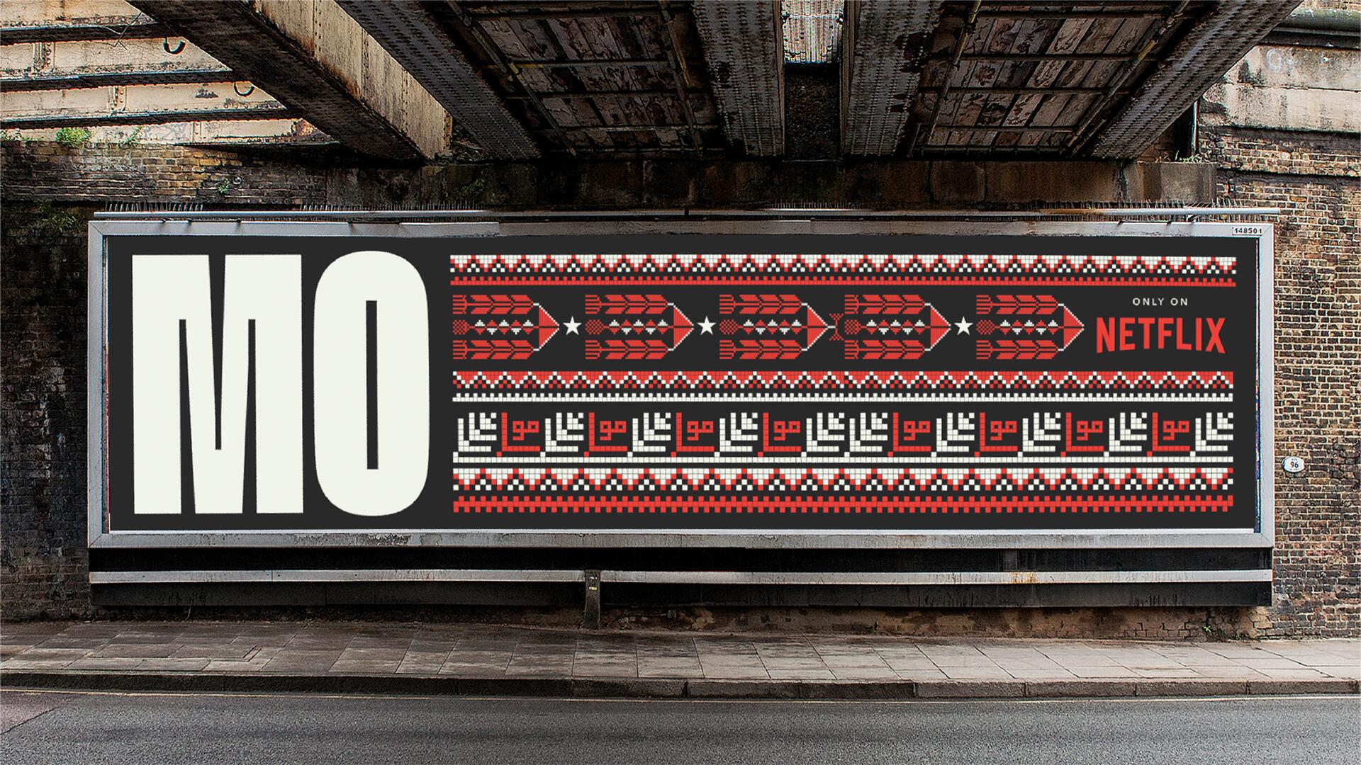 A billboard displays "MO" in large white letters on a black background with a red, black, and white geometric pattern beside it, promoting a Netflix show under a bridge.