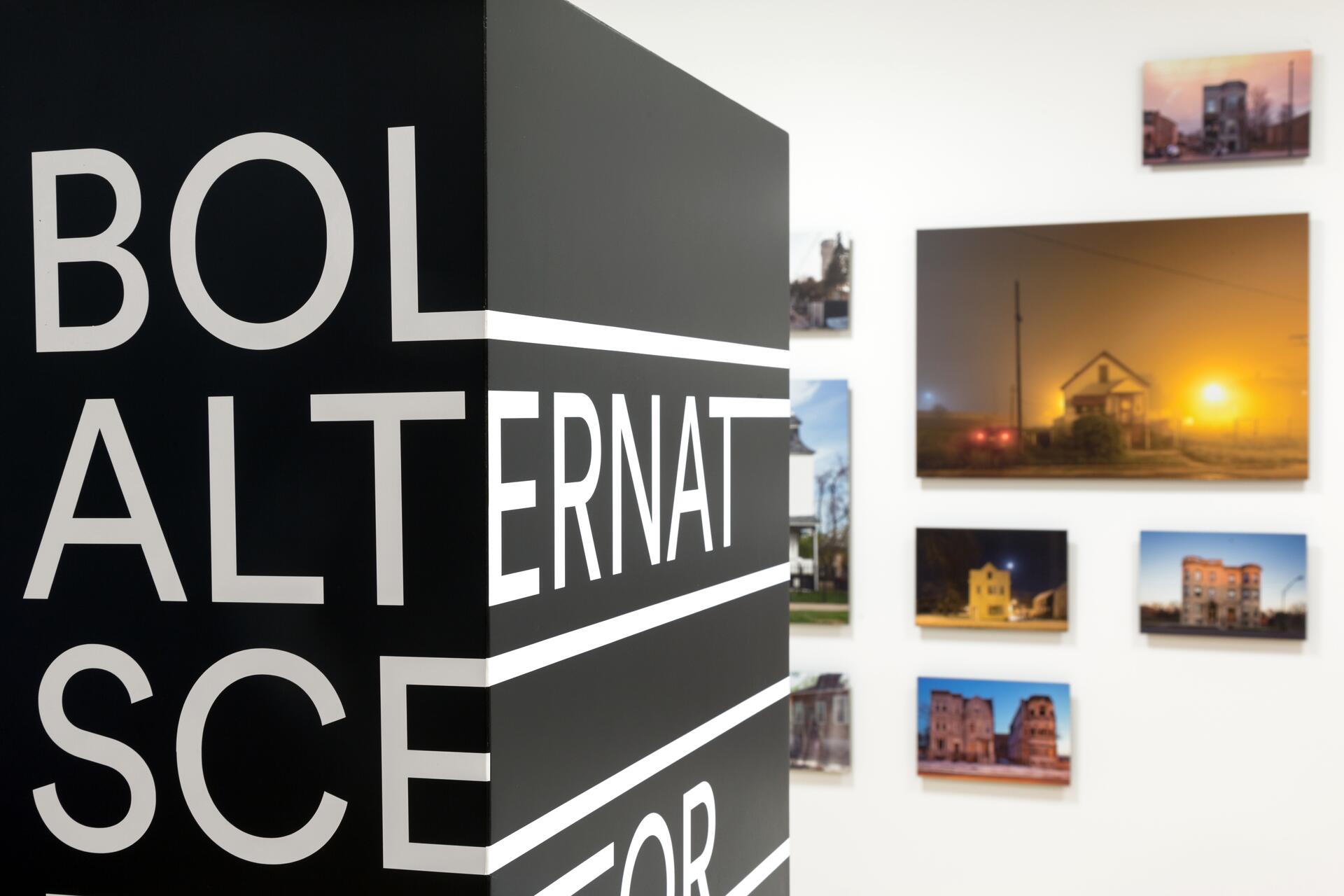 16A-46_Bold Exhibition Identity: Black wall with large white text wrapped around the corner_Renata Graw/Alexa Viscius