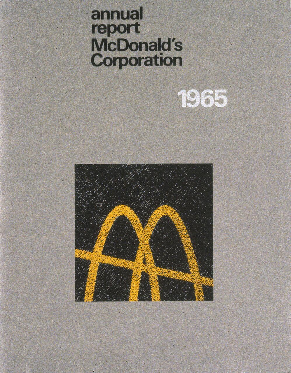 Gray cover with "annual report McDonald's Corporation 1965" in black and white text at the top. Below, there is a black square featuring a yellow McDonald's logo.